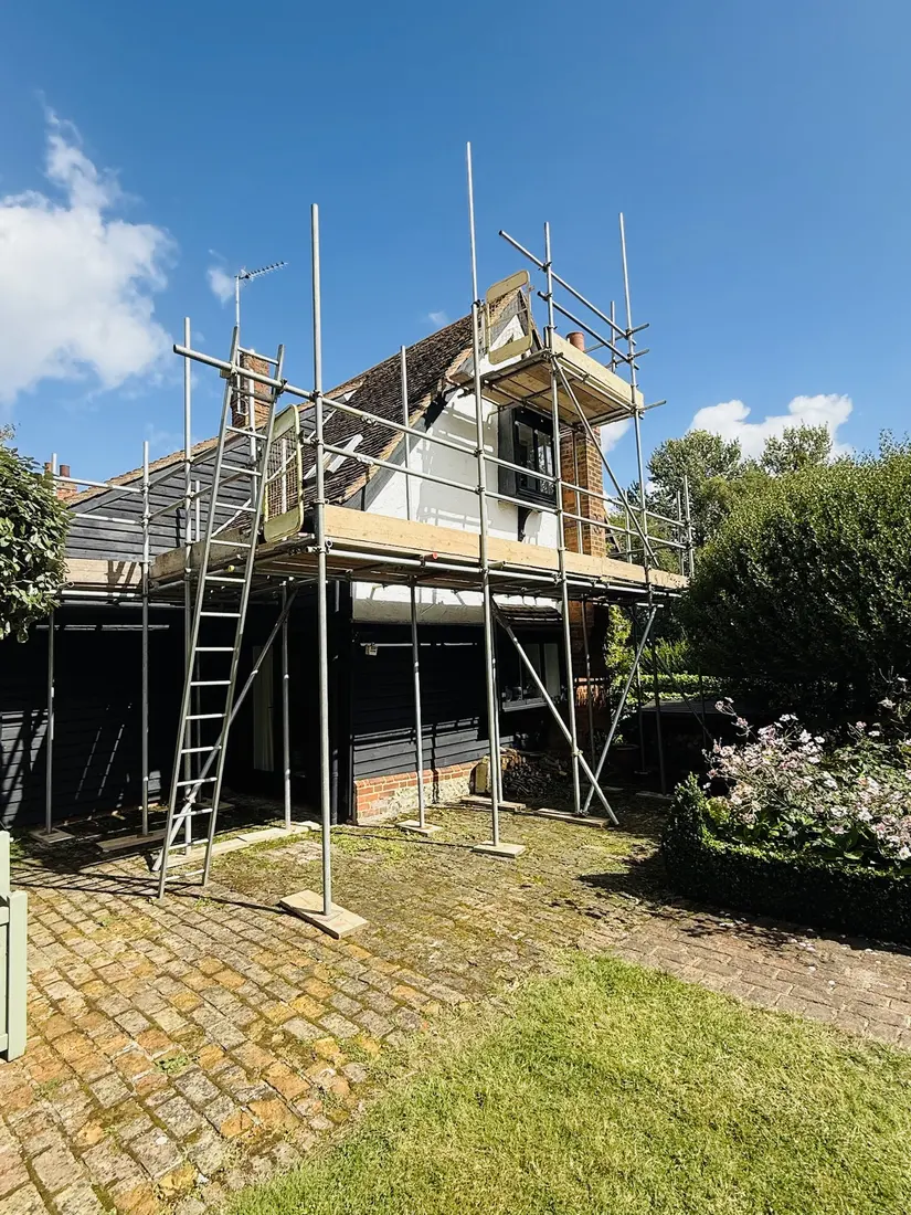 Roof access scaffold on a weatherboard cottage